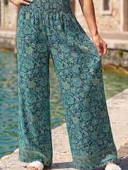 Roman Green Floral Print Tiered Palazzo Trousers - Image 1 of 4