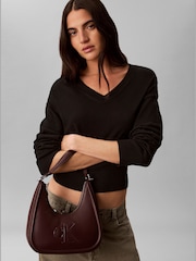 Calvin Klein Red Embossed Monogram Crescent Bag - Image 1 of 4