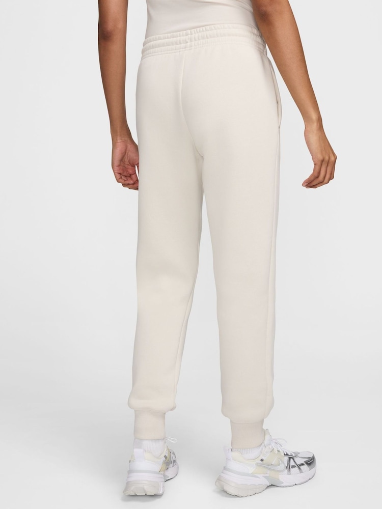 Nike Cream Phoenix Fleece Mid-Rise Logo Joggers - Image 1 of 9