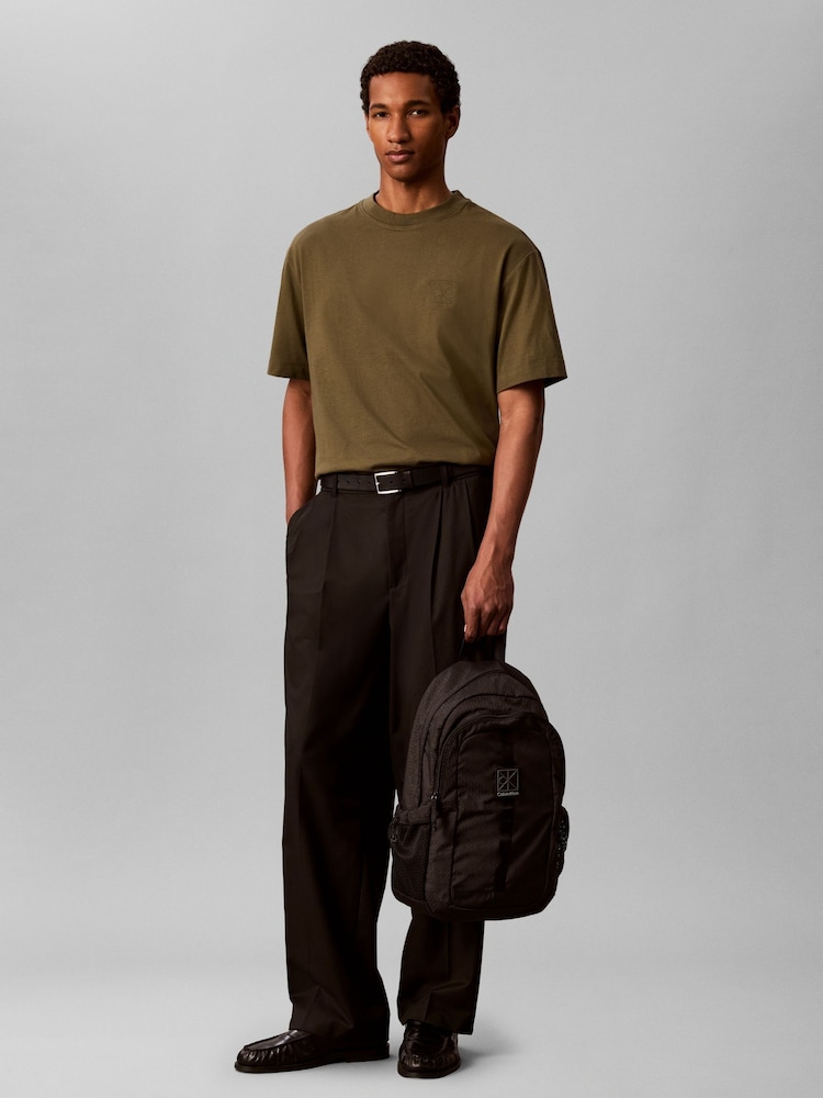 Calvin Klein Black Emblem Logo Backpack - Image 1 of 4 Calvin Klein Black Emblem Logo Backpack - Image 1 of 4
