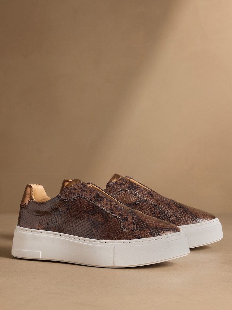 Russell & Bromley Brown Snake Park Mid Flatform Laceless Trainers - Image 1 of 7 Russell & Bromley Brown Snake Park Mid Flatform Laceless Trainers - Image 1 of 7