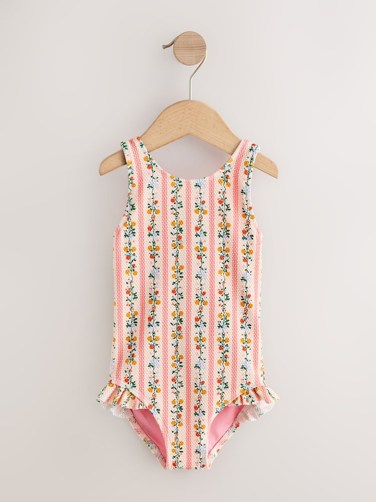 Pink/Orange Ditsy Frill Leg Swimsuit (3mths-7yrs) - Image 1 of 4 Pink/Orange Ditsy Frill Leg Swimsuit (3mths-7yrs) - Image 1 of 4
