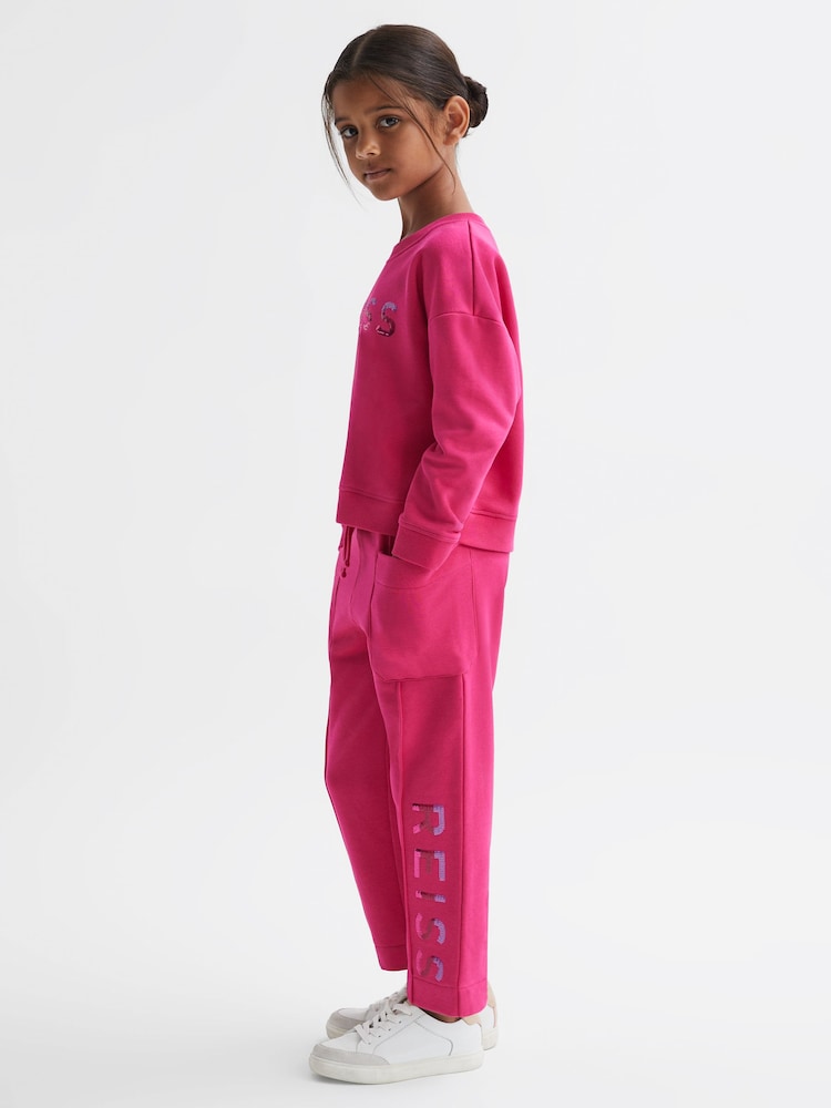 Reiss Bright Pink Mina 9-14 yrs Drawstring Front Seam Joggers - Image 1 of 6 Reiss Bright Pink Mina 9-14 yrs Drawstring Front Seam Joggers - Image 1 of 6