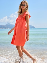 Coral Pink 100% Cotton Square Neck Crochet Flutter Sleeve Mini Dress - Image 1 of 7
