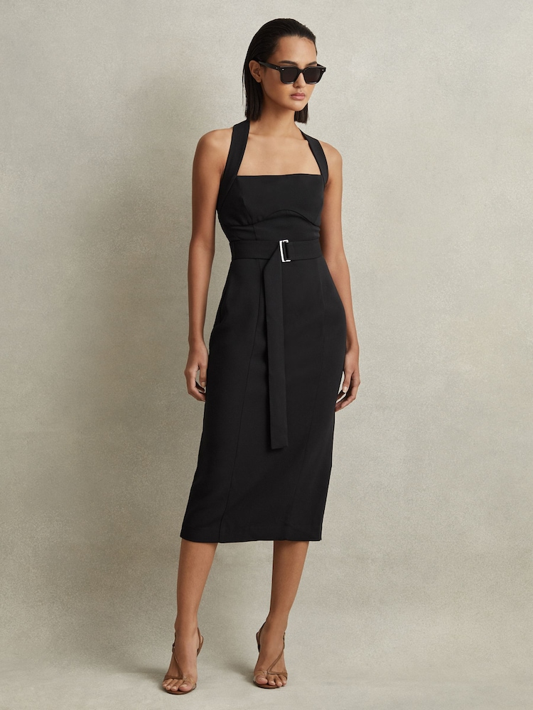 Stylish black summer office dress with a belted waist, paired with sunglasses for a chic, professional look.