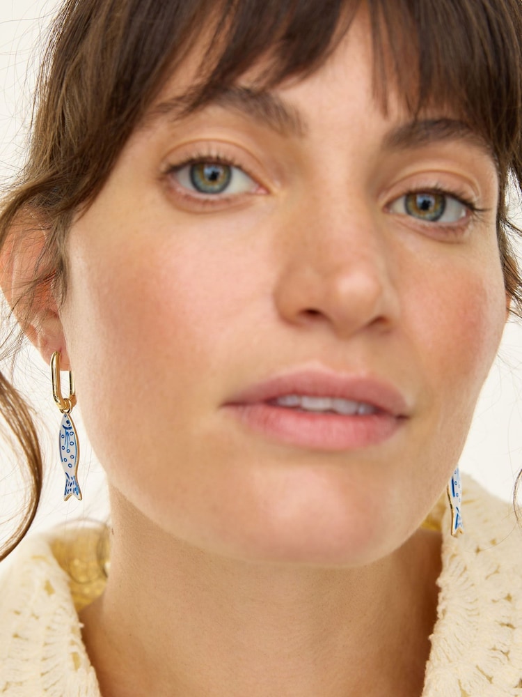 Oliver Bonas Blue Faith Fish Charm Drop Hoop Gold Tone Earrings - Image 2 of 2 Oliver Bonas Blue Faith Fish Charm Drop Hoop Gold Tone Earrings - Image 2 of 2