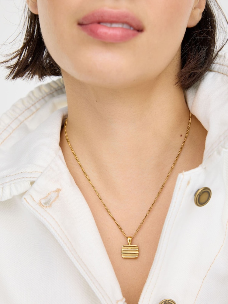 Oliver Bonas Gold Bibi Gold Tone Waterproof Ridged Disc Pendant Necklace - Image 4 of 4 Oliver Bonas Gold Bibi Gold Tone Waterproof Ridged Disc Pendant Necklace - Image 4 of 4