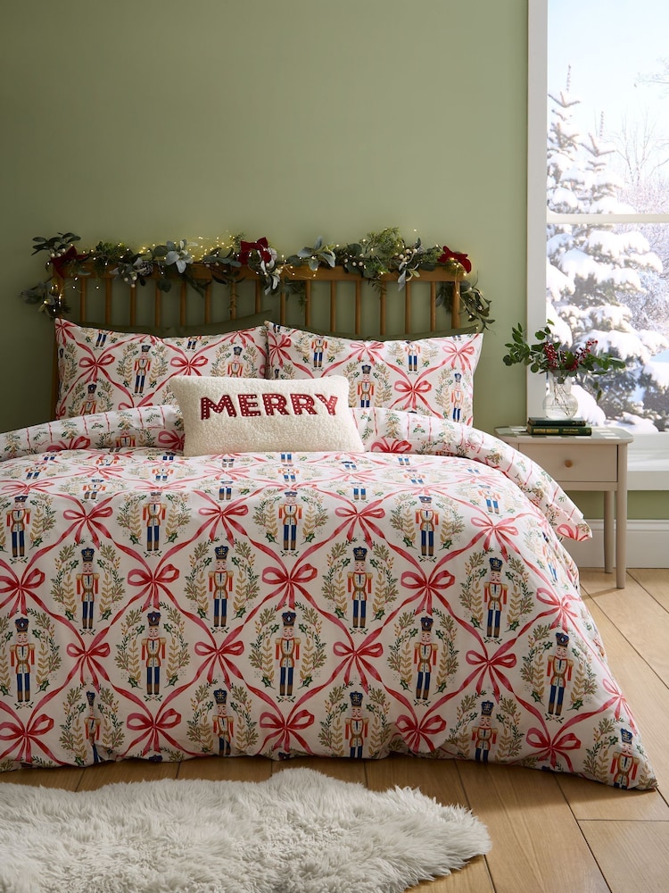 Funda de edredón y funda de almohada con el cascanueces navideño y lazos de Catherine Lansfield - Imagen 1 de 5 Funda de edredón y funda de almohada con el cascanueces navideño y lazos de Catherine Lansfield - Imagen 1 de 5