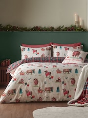 Catherine Lansfield – wendbares Bettbezug- und Kissenbezug-Set mit Weihnachts-Hochlandrind-Motiv - Bild 1 von 5