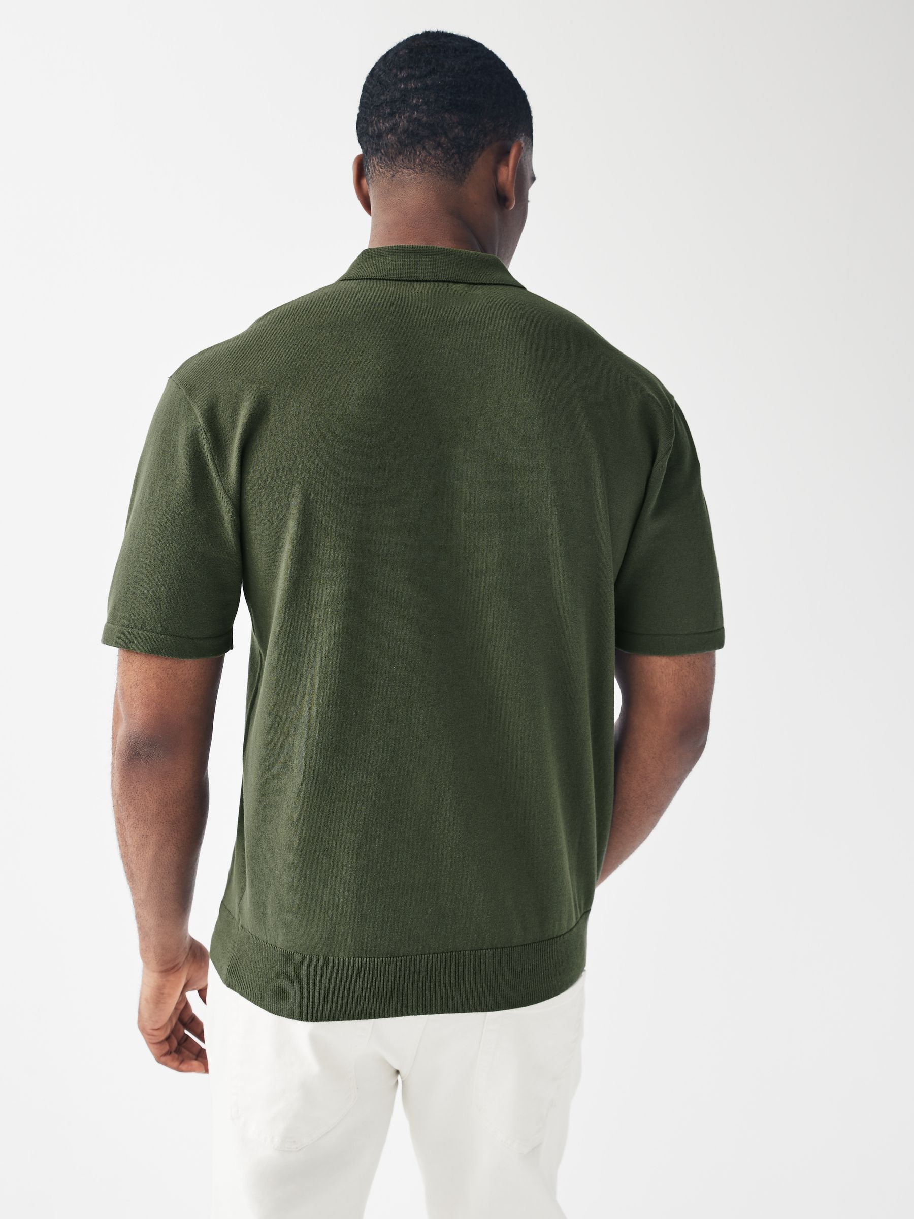 Buy Green Knitted Regular Fit Zip Polo Shirt from Next