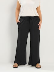 Yours Curve Black Soft Touch Wide Leg Trousers - Image 1 of 5