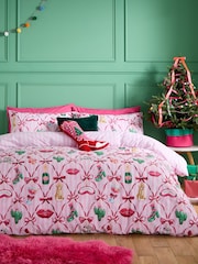 Catherine Lansfield Pink Christmas Kitsch Reversible Duvet Cover and Pillowcase Set - Image 1 of 5