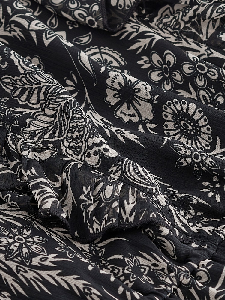 Monochrom geblümt - Langärmeliges Minikleid mit Rüschen - Bild 7 von 7