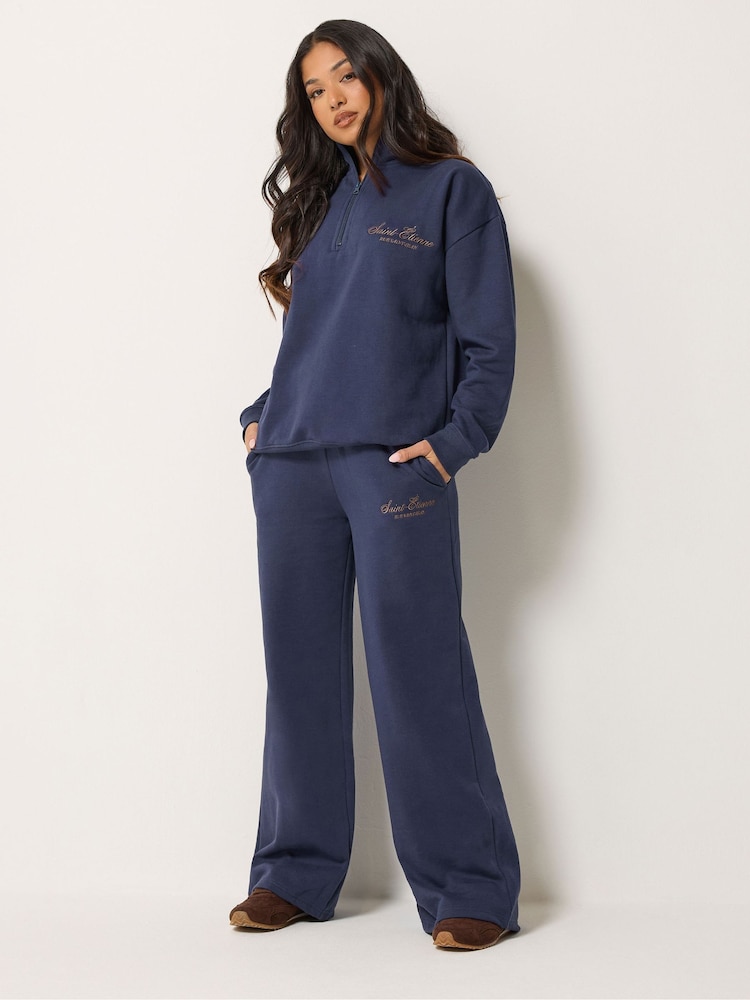 PixieGirl Petite Blue Etienne Slogan Wide Leg Joggers - Image 1 of 6 PixieGirl Petite Blue Etienne Slogan Wide Leg Joggers - Image 1 of 6
