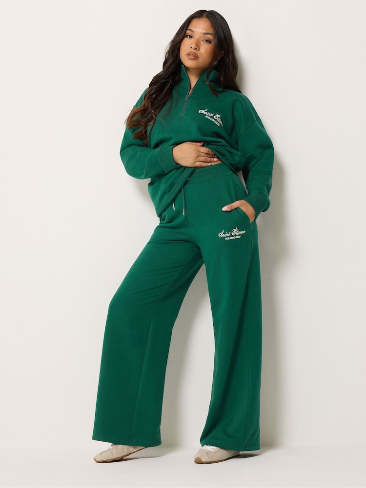 PixieGirl Petite Green Etienne Slogan Wide Leg Joggers - Image 1 of 6 PixieGirl Petite Green Etienne Slogan Wide Leg Joggers - Image 1 of 6