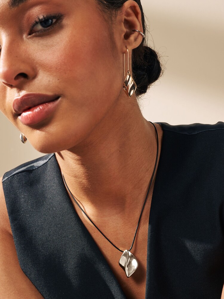 Gold Tone Wave Drop Black Cord Necklace Made with Recycled Metal - Image 1 of 4