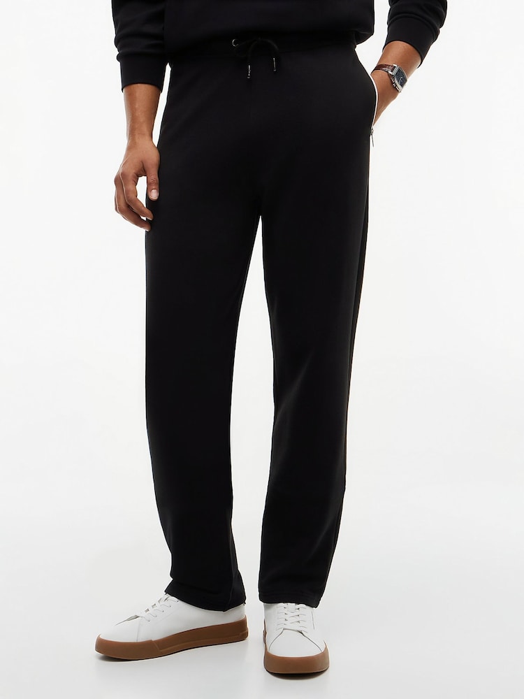 Tommy Hilfiger Black Global Stripe Pocket Terry Joggers - Image 1 of 6 Tommy Hilfiger Black Global Stripe Pocket Terry Joggers - Image 1 of 6