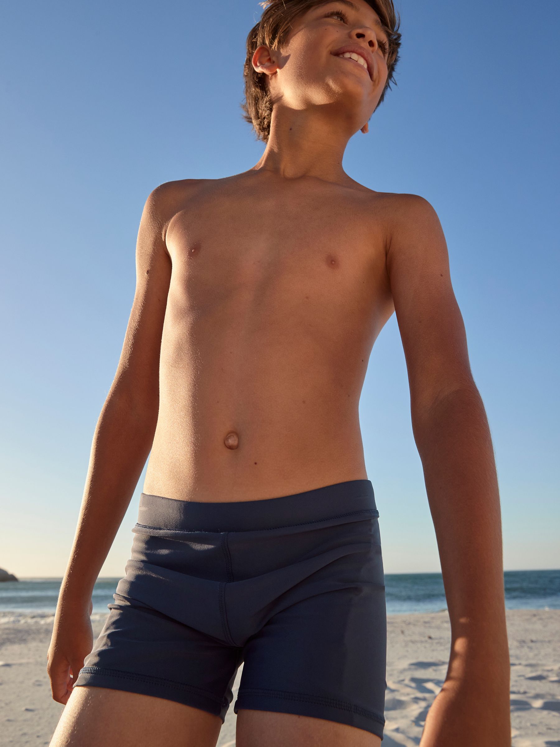 Buy Navy Blue Shorter Length Stretch Swim Shorts (3 16yrs) from the