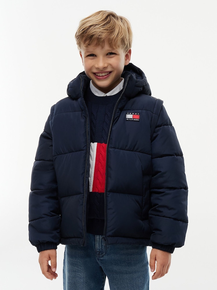 Tommy Hilfiger Dark Blue Heritage Back Logo Ripstop Puffer Jacket with Removable Sleeves - Image 1 of 7 Tommy Hilfiger Dark Blue Heritage Back Logo Ripstop Puffer Jacket with Removable Sleeves - Image 1 of 7