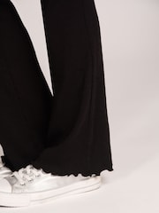 Pantalones legging acampanados con estampado de Pineapple y canalé - Imagen 5 de 6
