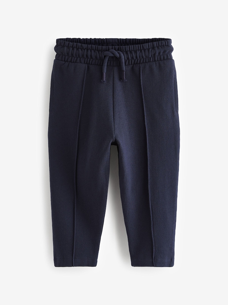 Navy Blue Pintuck 100% Cotton Joggers (3mths-7yrs) - Image 1 of 3 Navy Blue Pintuck 100% Cotton Joggers (3mths-7yrs) - Image 1 of 3