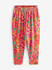 Rostrot-Orange/Rosa mit tropischem Blumenprint - Leichte Jerseyhose mit Stretch (3–16 Jahre) - Bild 4 von 6
