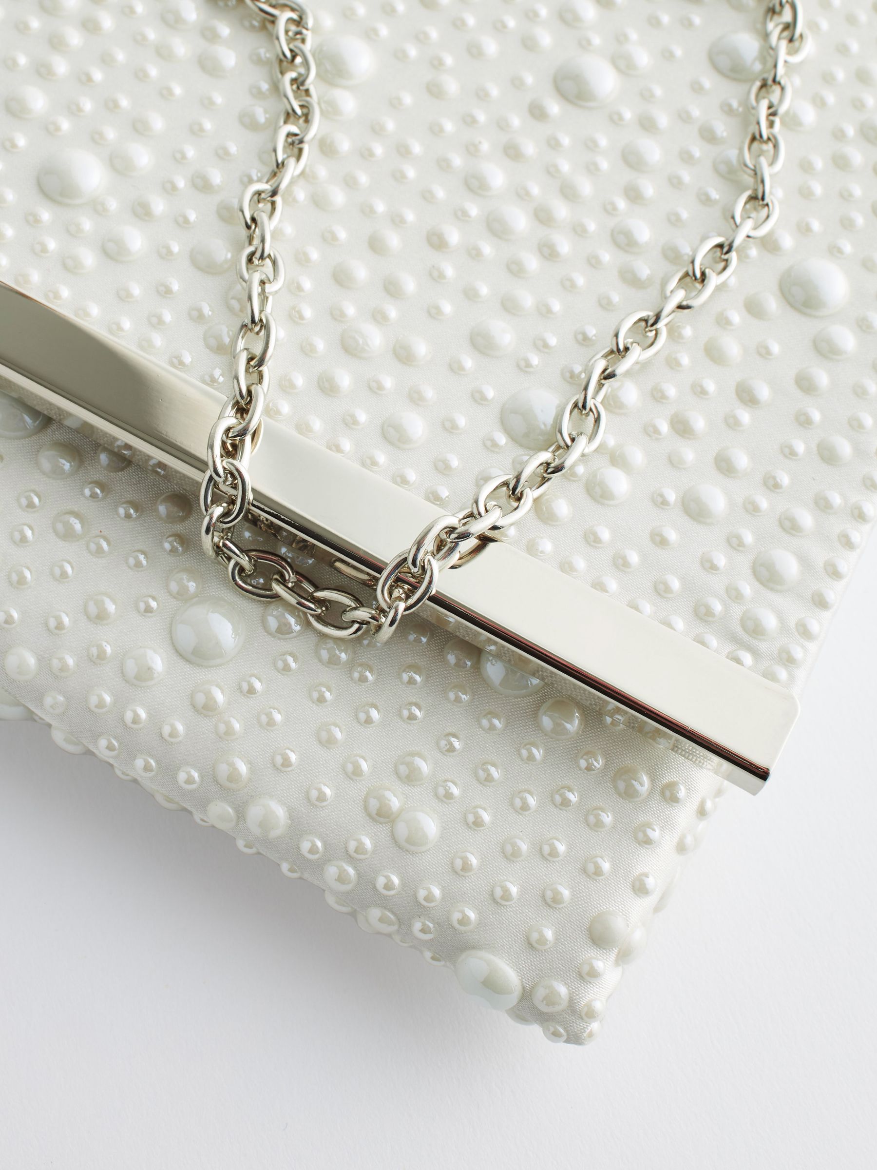 White clutch bag with silver chain store