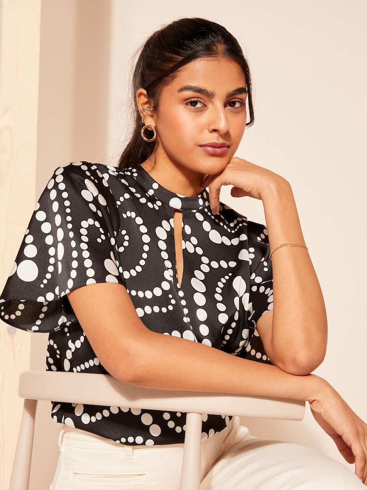 Friends Like These Black Spot Printed Flutter Sleeve Keyhole Blouse - Image 1 of 4