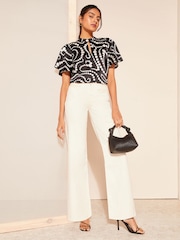 Friends Like These Black Spot Printed Flutter Sleeve Keyhole Blouse - Image 3 of 4