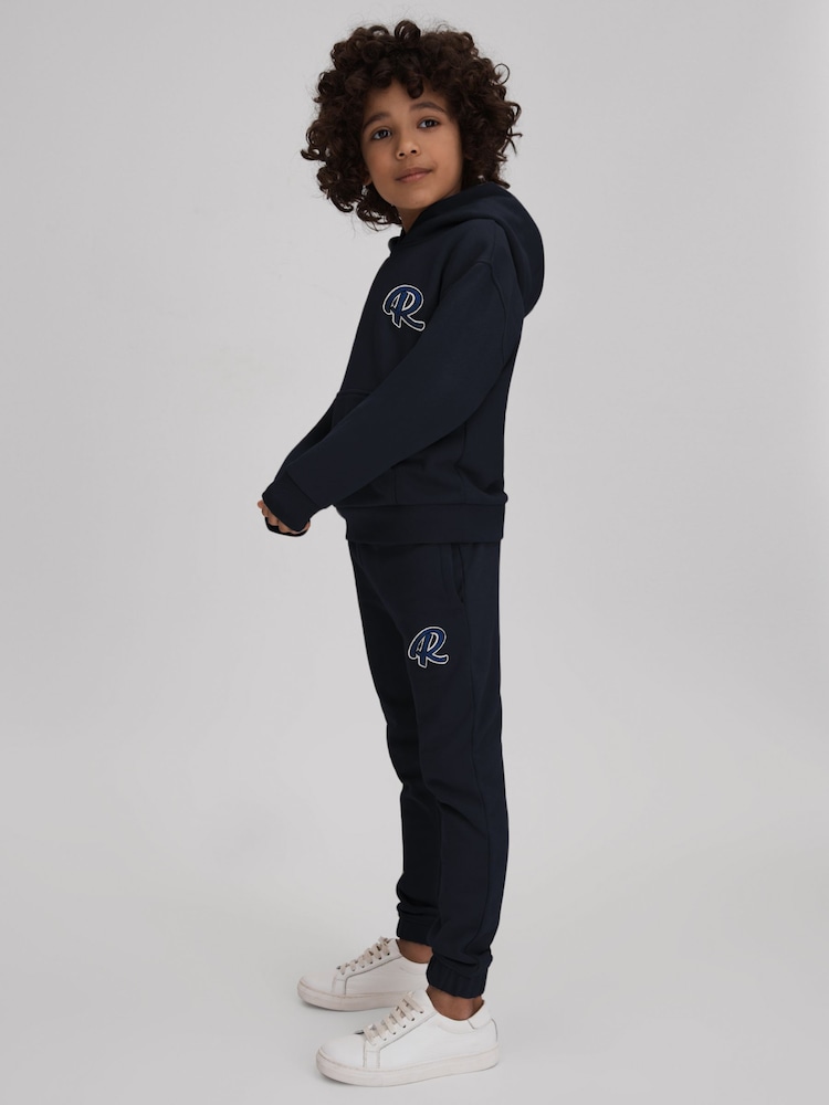 Reiss Navy Toby 9-13 yrs Cotton Elasticated Waist Motif Joggers - Image 1 of 4 Reiss Navy Toby 9-13 yrs Cotton Elasticated Waist Motif Joggers - Image 1 of 4