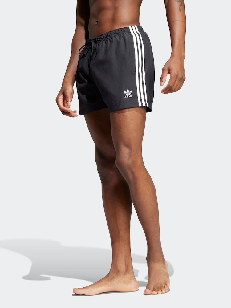 adidas Originals Black Adicolor 3-Stripes 5-Inch Swim Shorts - Image 1 of 6 adidas Originals Black Adicolor 3-Stripes 5-Inch Swim Shorts - Image 1 of 6