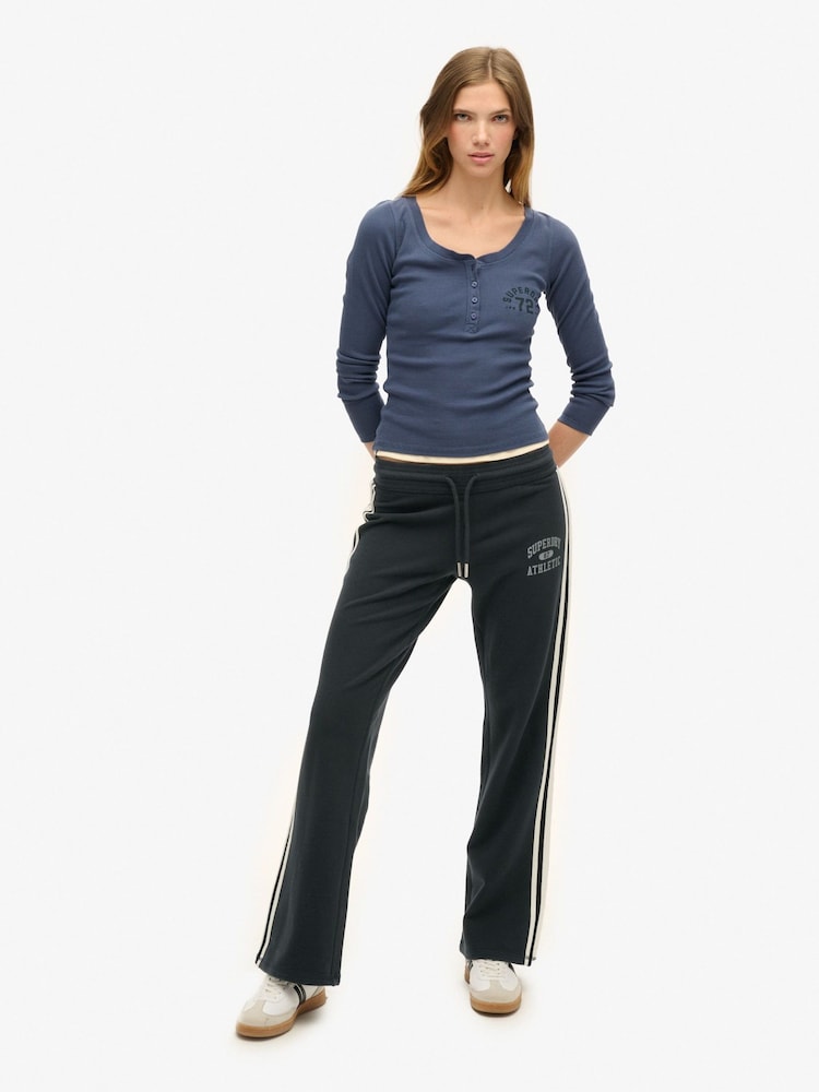 Superdry Eclipse Navy Athletic Stripe Flare 100% Cotton Joggers - Image 1 of 8 Superdry Eclipse Navy Athletic Stripe Flare 100% Cotton Joggers - Image 1 of 8