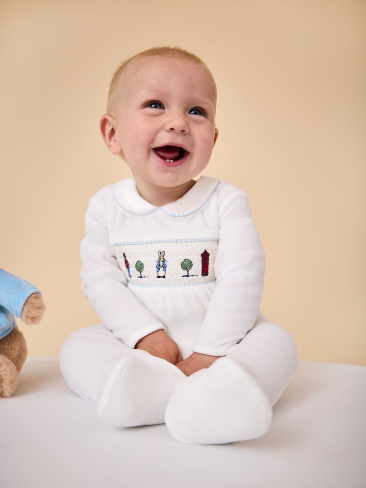 JoJo Maman Bébé Cream Peter Rabbit Smocked Velour All-In-One - Image 1 of 2 JoJo Maman Bébé Cream Peter Rabbit Smocked Velour All-In-One - Image 1 of 2