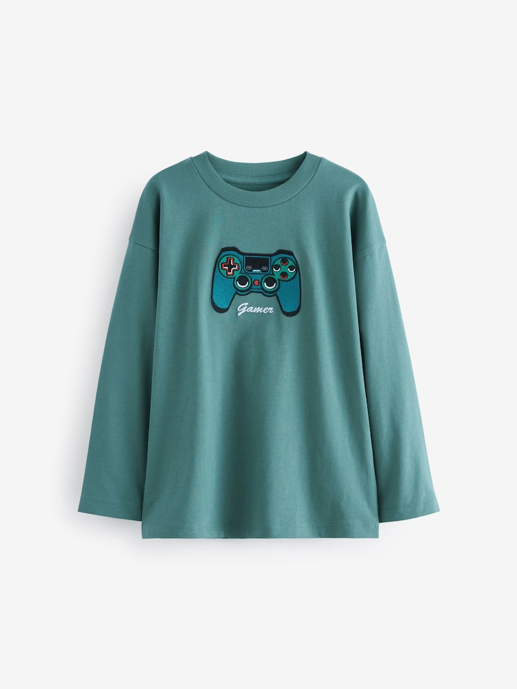 Diseño bordado de mando de videojuegos en verde - Camiseta gráfica de manga larga de corte holgado (3-16años) - Imagen 1 de 3 Diseño bordado de mando de videojuegos en verde - Camiseta gráfica de manga larga de corte holgado (3-16años) - Imagen 1 de 3