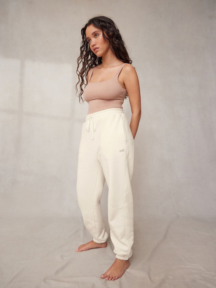 self. Ecru White Cotton Blend Cuffed Joggers - Image 1 of 8