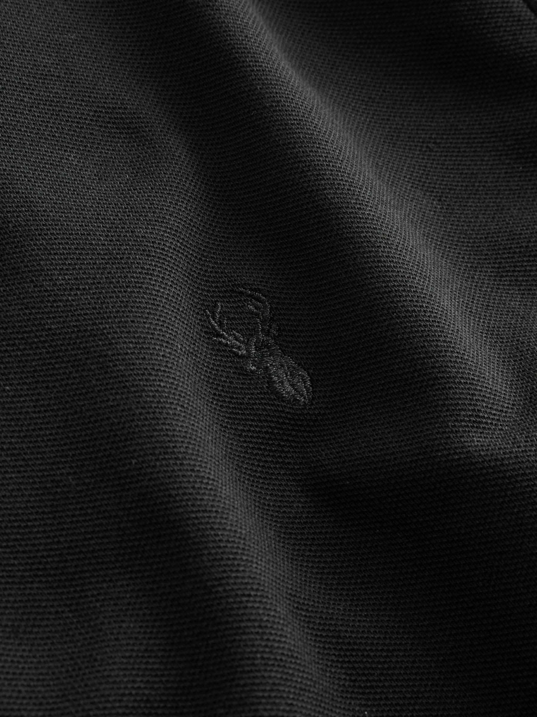 Buy Black Regular Fit Short Sleeve Pique Polo Shirt from Next