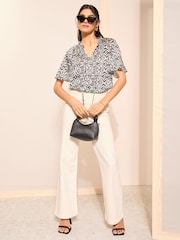 Friends Like These Black Polka Dot Printed Flutter Sleeve Keyhole Blouse - Image 2 of 4