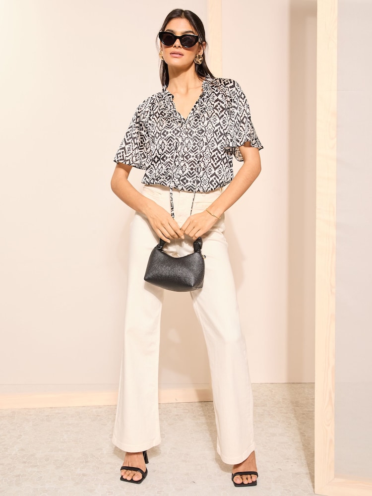 Friends Like These Black Polka Dot Printed Flutter Sleeve Keyhole Blouse - Image 2 of 4 Friends Like These Black Polka Dot Printed Flutter Sleeve Keyhole Blouse - Image 2 of 4