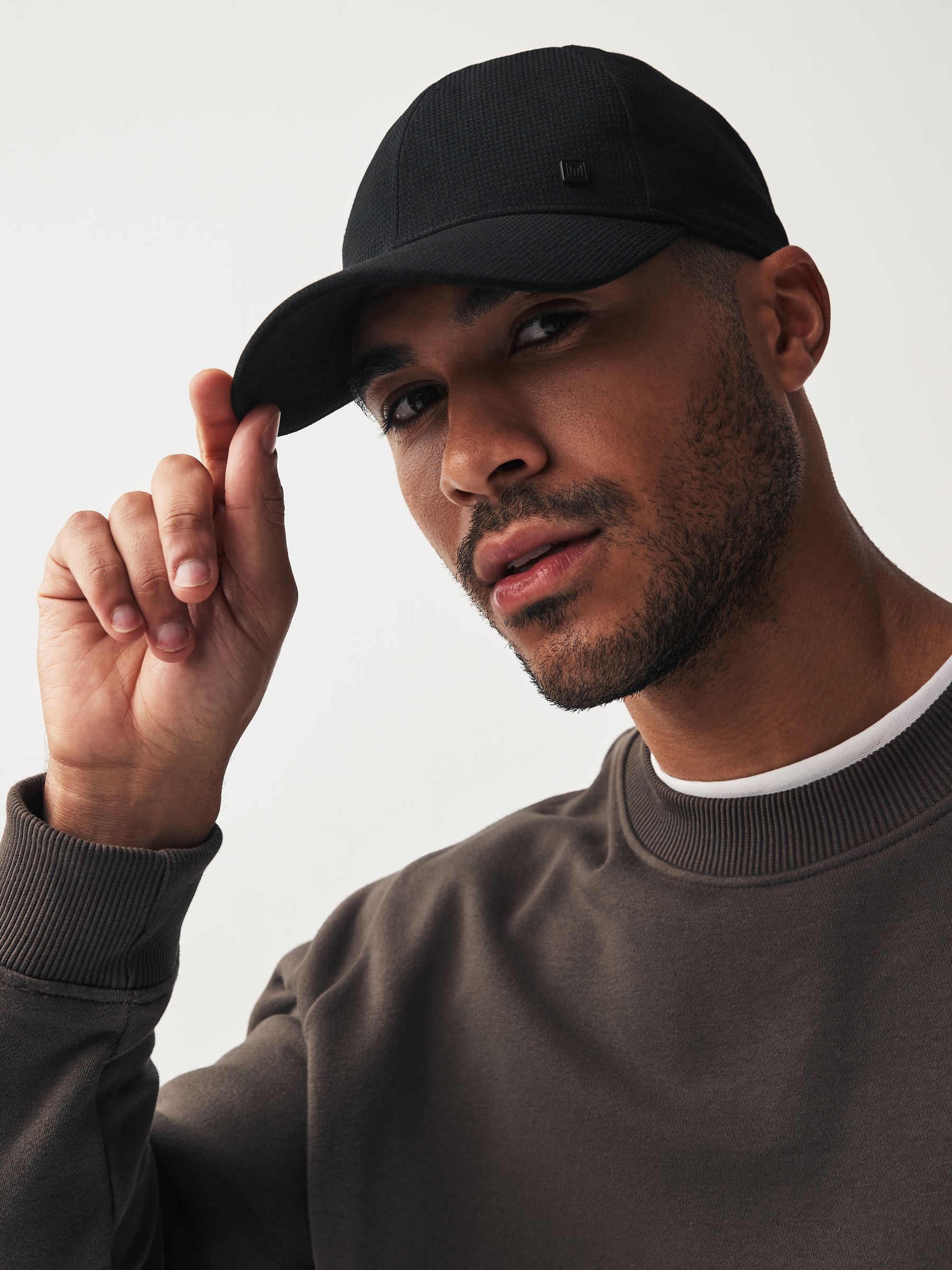 Buy Black Textured Cap from Next Germany