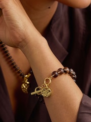 The Edit by Estella Bartlett Gold Tone Chunky Smokey Quartz with Hammered Disc Charm Bracelet - Image 1 of 3