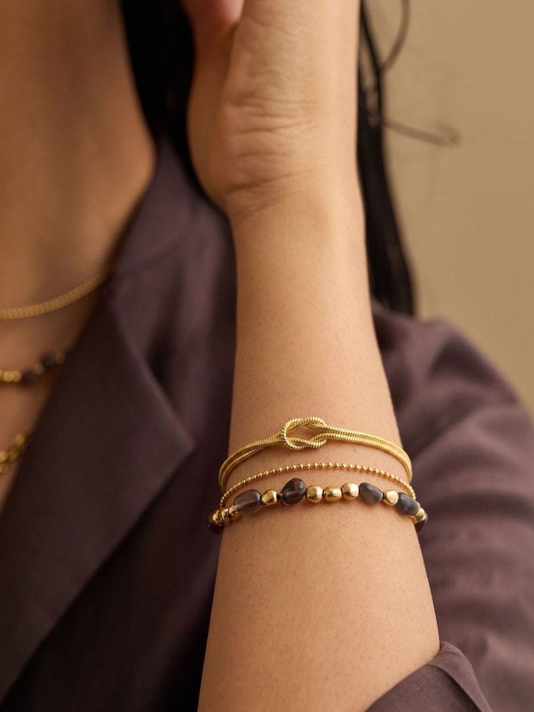 The Edit by Estella Bartlett Gold Tone Double Chain Knot Bracelet - Image 1 of 3 The Edit by Estella Bartlett Gold Tone Double Chain Knot Bracelet - Image 1 of 3