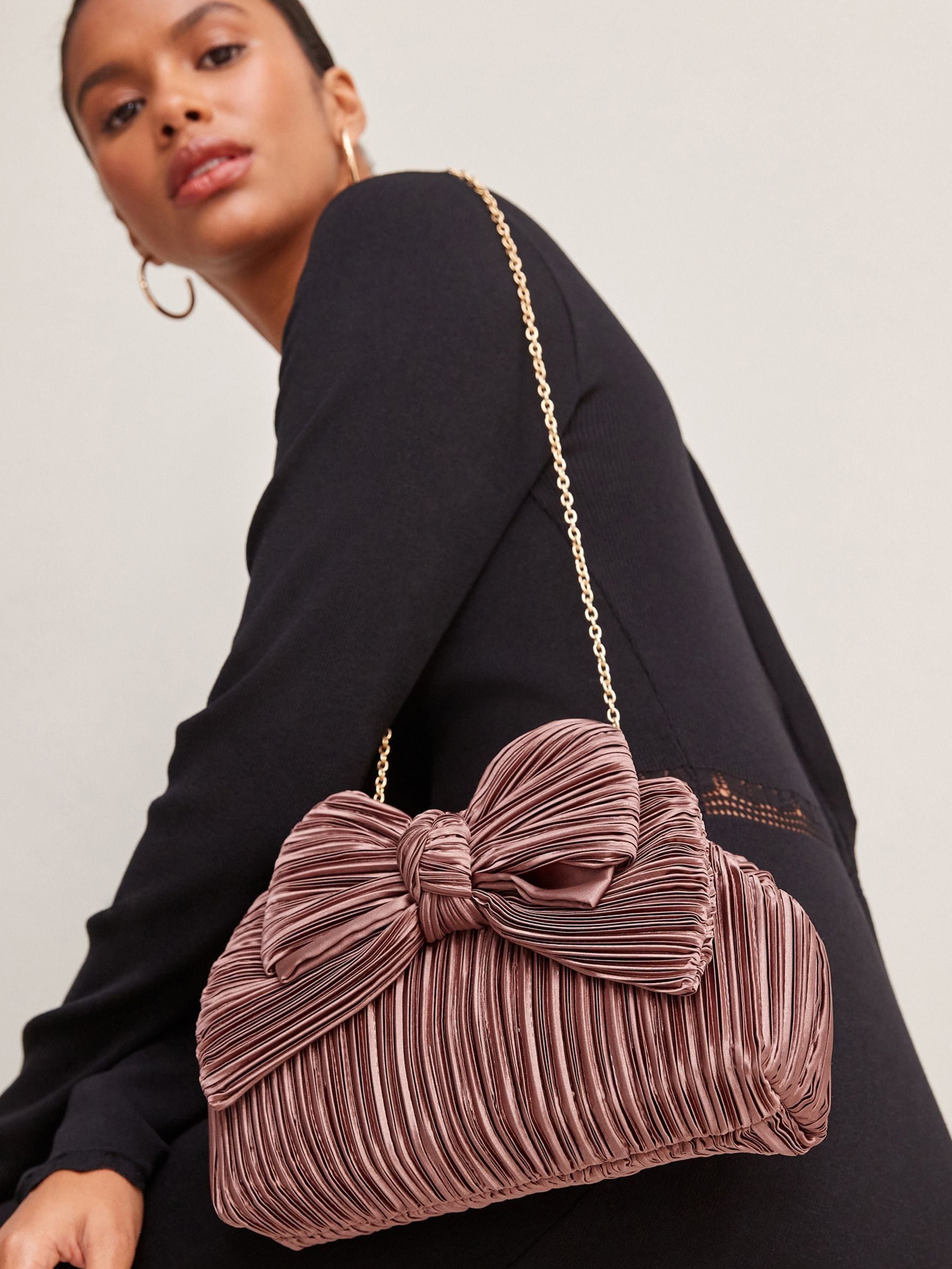 Buy Blush Pink Pleated Bow Clutch Bag from Next Luxembourg