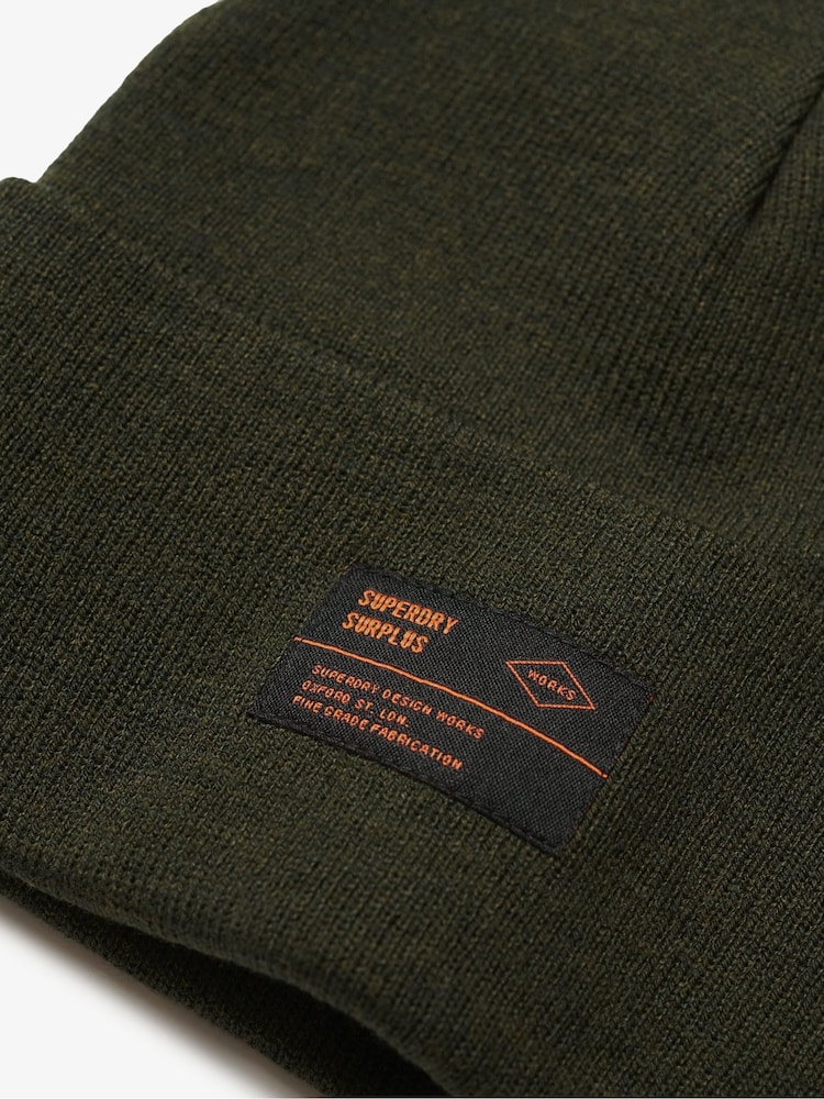 Olivno zelena - Superdry 100% Cotton Surplus Knitted Čepica klobuki in kape; pokrivala - Slika 2 iz 2 Olivno zelena - Superdry 100% Cotton Surplus Knitted Čepica klobuki in kape; pokrivala - Slika 2 iz 2