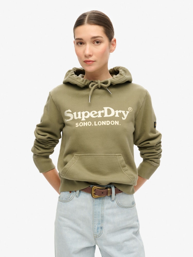 Verde oliva polvoriento - Sudadera de algodón 100 % con capucha y diseño de efecto metalizado Venue de Superdry - Imagen 1 de 4
