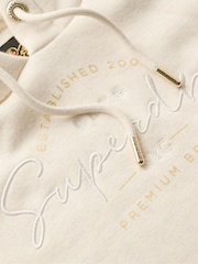 كريمي شوفاني بخيوط شاحبة - سترة هودي بشعار معدني Luxe من Superdry - صورة 4 من 4