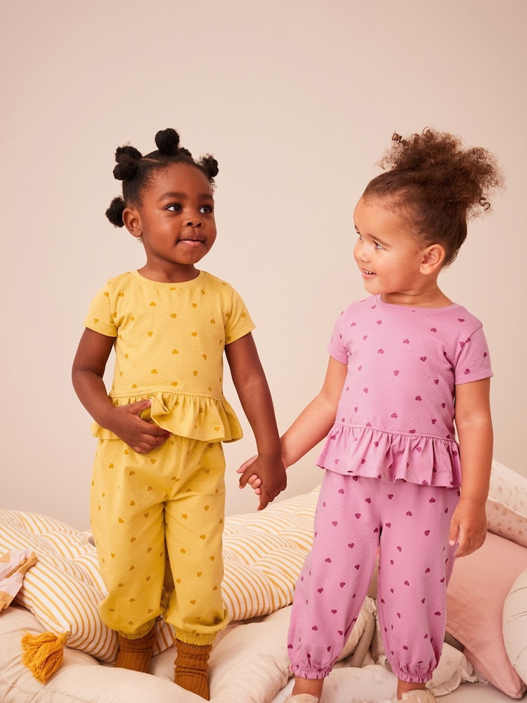 وردي/أصفر - حزمة من قطعتين (2) بيجامات نسيجية مع بنطلون بتصميم رياضي (9 شهور-10 سنوات) - صورة 1 من 1