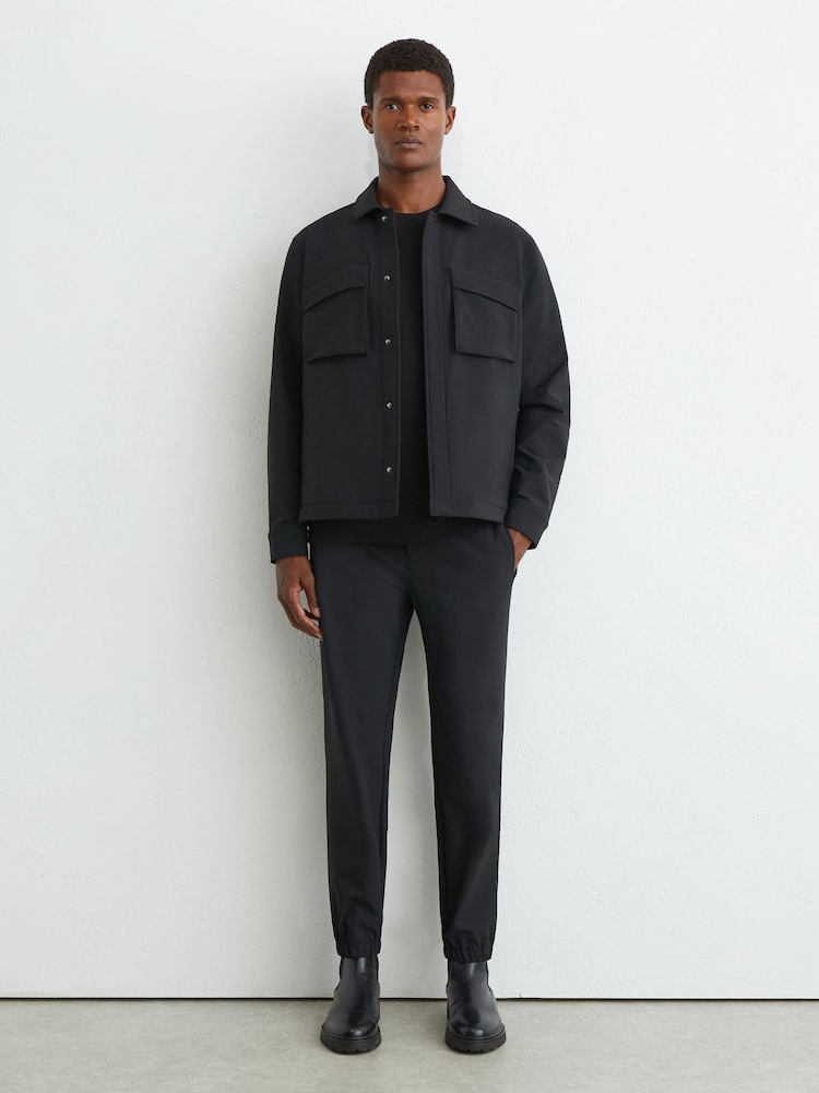 Reiss Black Divide Trousers Technical Stretch Tapered Trousers - Image 1 of 7 Reiss Black Divide Trousers Technical Stretch Tapered Trousers - Image 1 of 7
