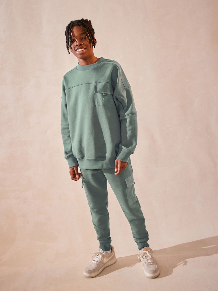 Sage Green Set Utility Crew Neck Sweatshirt and Cargo Jogger Set (3-16yrs) - Image 1 of 11 Sage Green Set Utility Crew Neck Sweatshirt and Cargo Jogger Set (3-16yrs) - Image 1 of 11