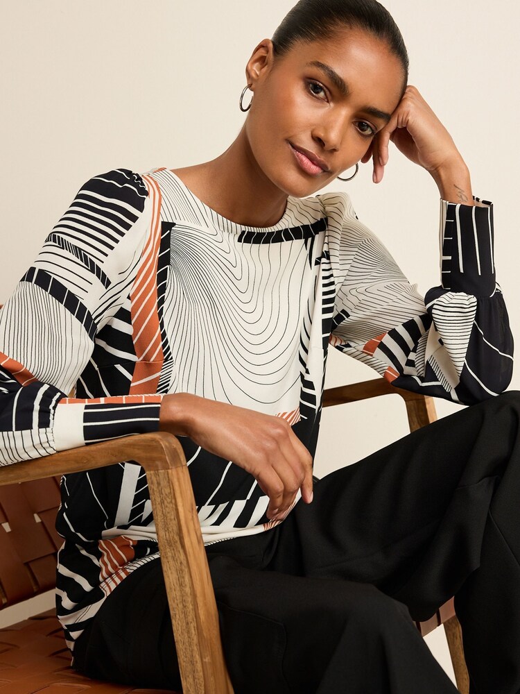 Black/White/Orange Geo Swirl Long Sleeve Crew Neck Cuff Blouse - Image 1 of 6