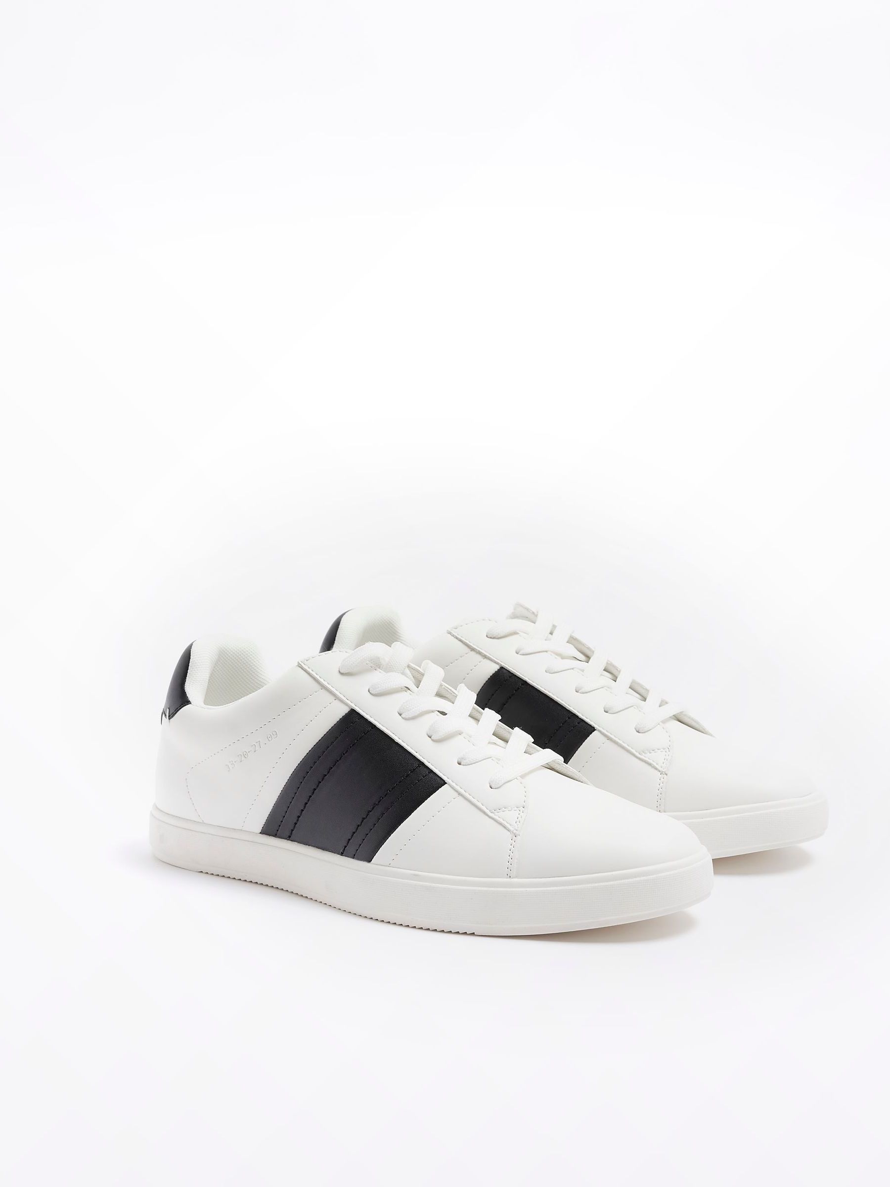 white trainers with black stripe